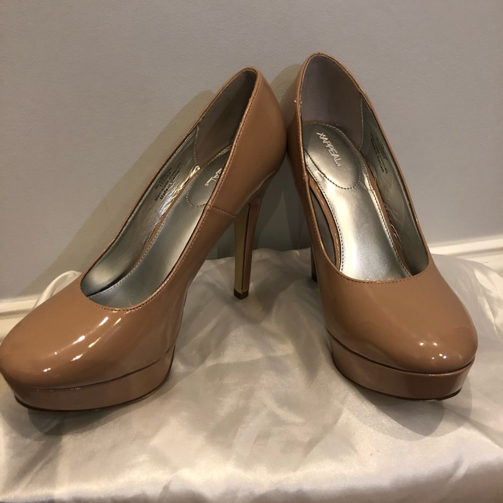Nude patent pumps